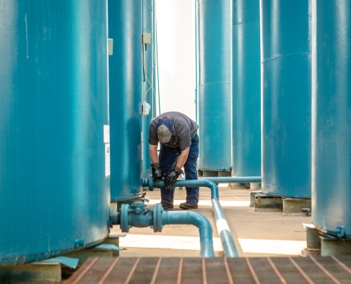 Technician working on Gasoline, Diesel & Kerosene fuel tanks and pipes.