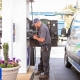 Gasoline, Diesel & Kerosene technician at a gas station pump.