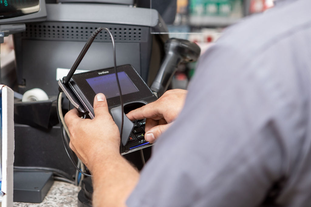 Verifone C18 Kiosk Technician working on C18 Verifone POS system