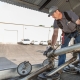 Hutchens Rentz-Eden employee filling a fuel truck from a storage tank getting ready for a fuel delivery.