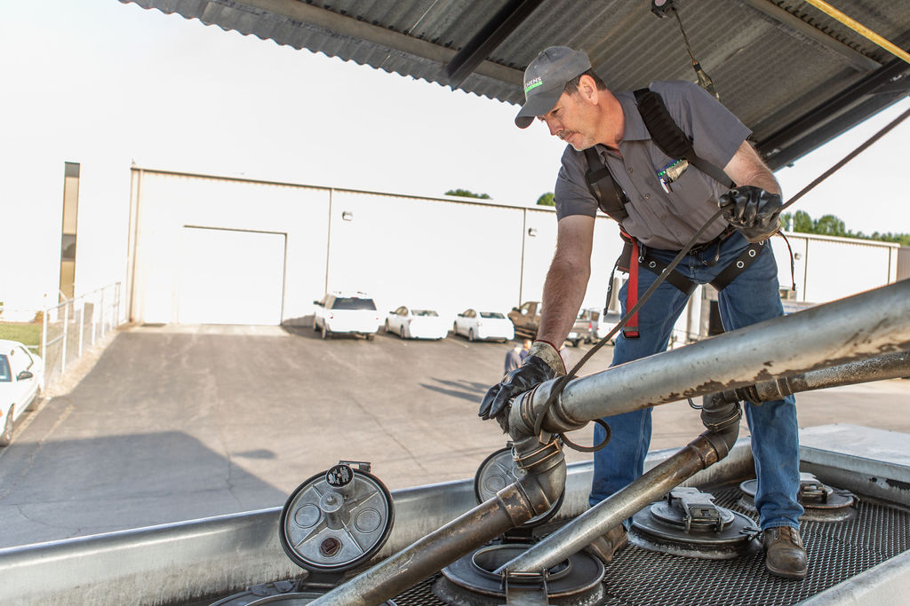 Hutchens(23) Hutchens Rentz-Eden employee filling a fuel truck from a storage tank getting ready for a fuel delivery.