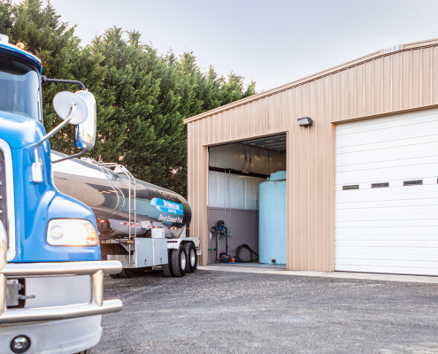 Hutchens tanker backing in to fill DEF storage tank in garage