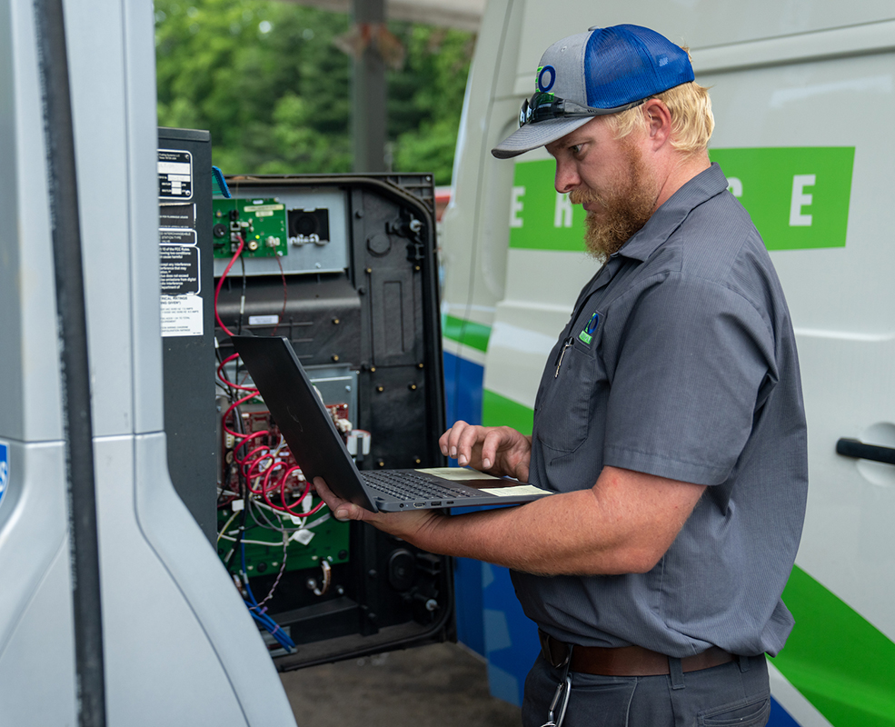 HRE-134 REO technician working on an on-site fuel pump
