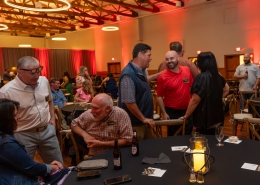 Group chatting at Hutchens 50th Anniversary Event