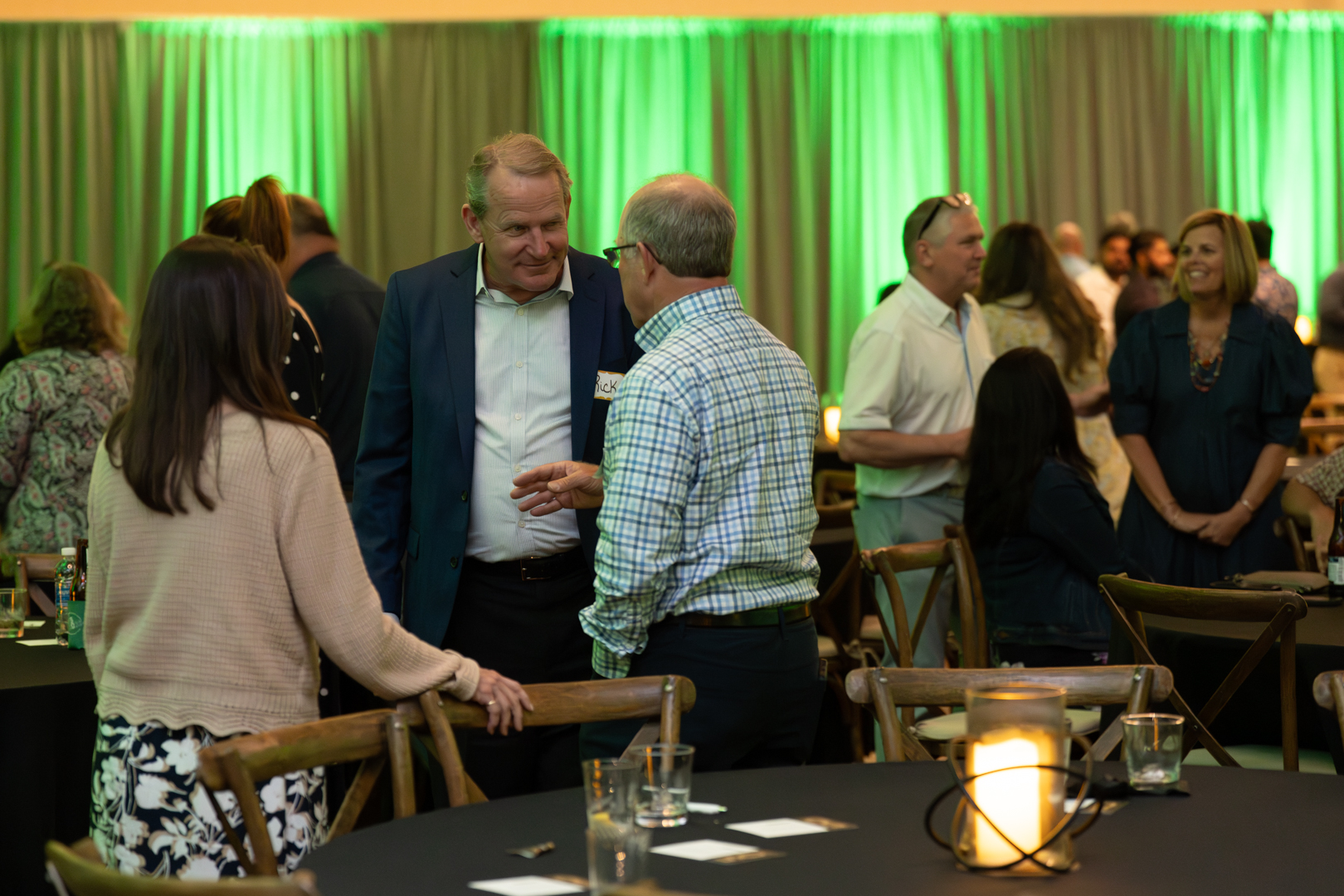 Group chatting at Hutchens 50th Anniversary Event