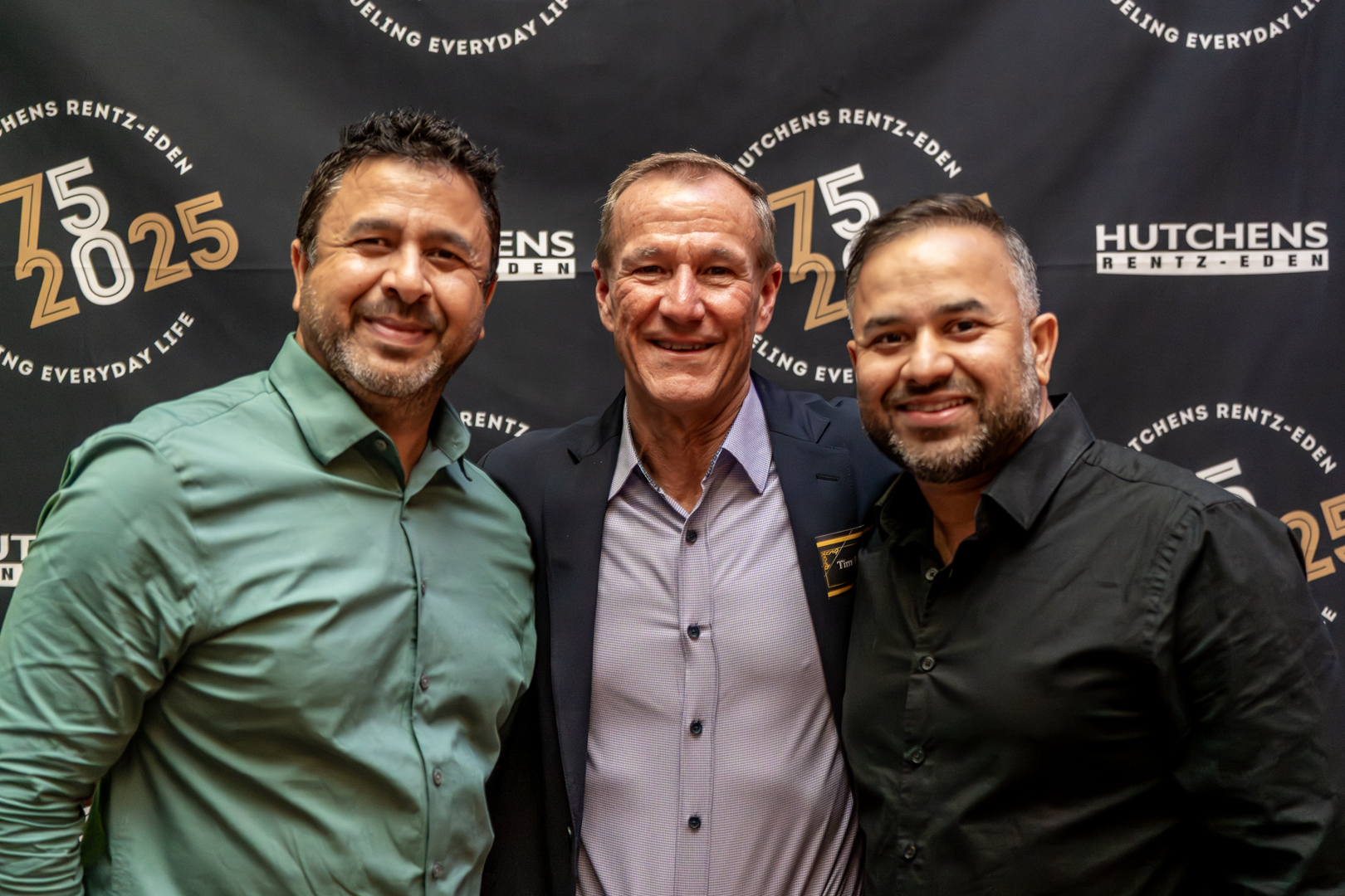 Posing for a photo at Hutchens 50th Anniversary Event