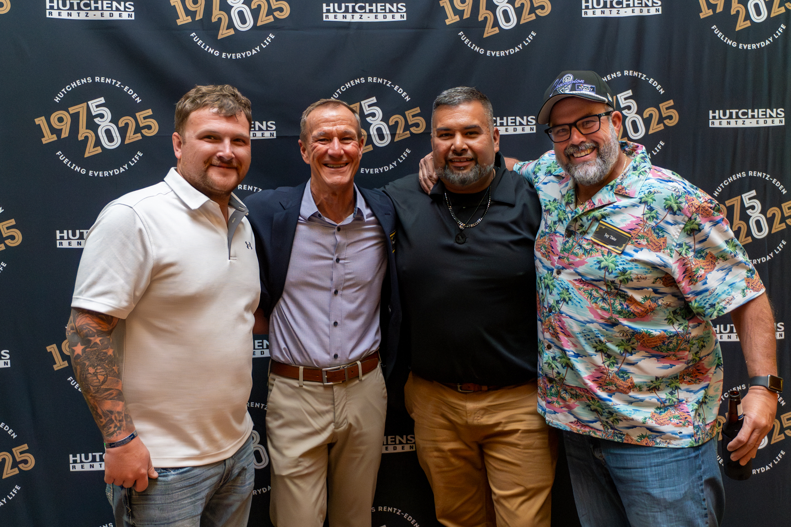 Posing for a photo at Hutchens 50th Anniversary Event