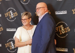 Posing for a photo at Hutchens 50th Anniversary Event