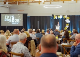 Listening to a speech at Hutchens 50th Anniversary Event