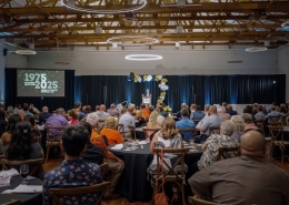 Listening to a speech at Hutchens 50th Anniversary Event