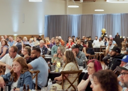 Listening to a speech at Hutchens 50th Anniversary Event